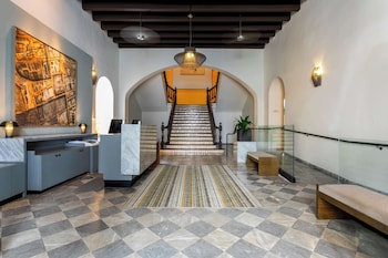 Hotel entrance and lobby at Palacio Provincial San Juan, Curio Collection by Hilton