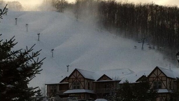 A lodge with a traditional timber-framed design, situated at the base of a snowy slope. - 1 Bedroom Villa at Mountain Run at Boyne Mountain (Boyne Falls)