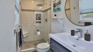 Bathtub, hair dryer, towels, soap