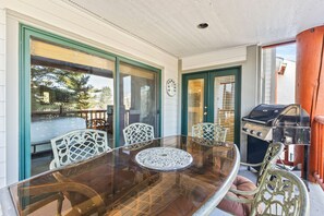 Enjoy casual dining in this outdoor space with a glass-top table and comfortable seating for four.