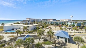 A resort with multiple buildings, a beach, and a pool area. - SeaCrest 501AB - 3 BR Gulf Front  and Free Seasonal Beach Service (Fort Walton Beach)