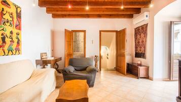 Apartment, 1 Bedroom, Patio | Living area | 32-inch flat-screen TV with digital channels, TV