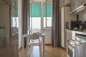 Enjoy meals in the kitchen with stainless steel appliances and a dining area.