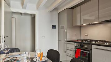 Apartment, 1 Bedroom, Balcony | Private kitchen | Full-size fridge, oven, stovetop, coffee/tea maker