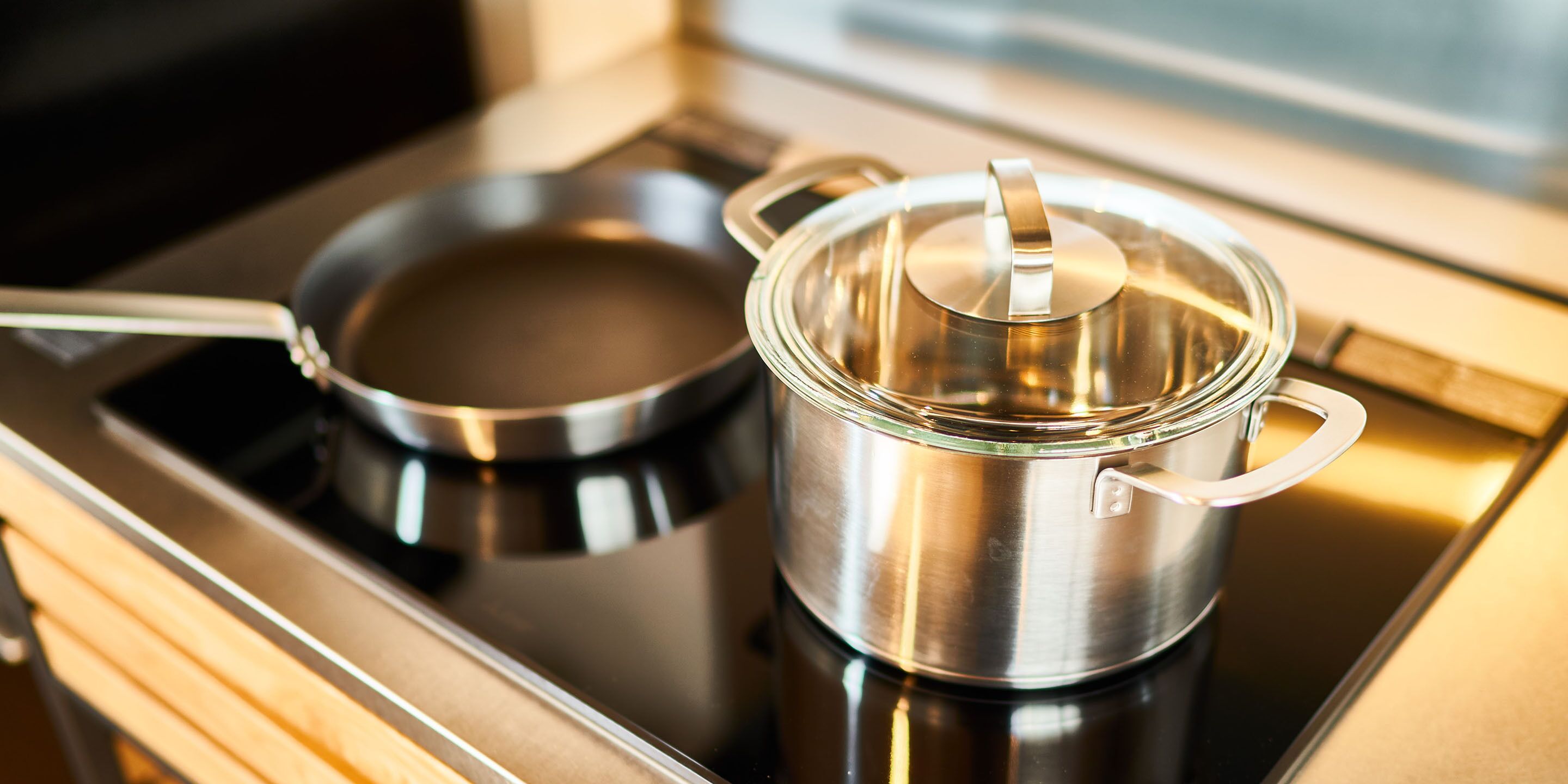 A stainless steel pot and pan on a stove.