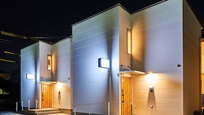 A modern building with three doors, each with a small light above. - Rakuten STAY HOUSE WILL STYLE Saga Imari (Imari)