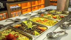 A buffet with various food options and serving utensils. - Kuban Resort and Aquapark (Nessebar)