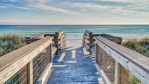 A wooden boardwalk leading to a beach with a clear view of the ocean. - Sandy Toes Gated Community*Pool*Gym*Beach Svc! (Miramar Beach)