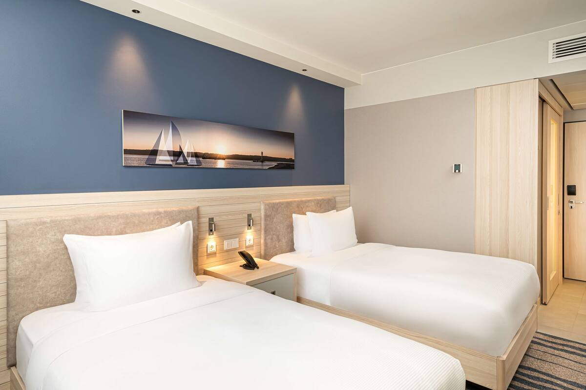 twin room | in-room safe, desk, laptop workspace, soundproofing