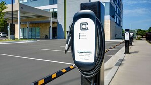 An electric vehicle charging station with a sign indicating it is a high power station. - Home2 Suites by Hilton Raleigh North I-540 (Raleigh)