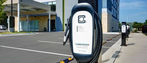 An electric vehicle charging station with a sign indicating it is a high power station.