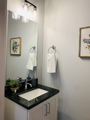 Combined shower/bathtub, hair dryer, towels, soap