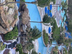 Outdoor pool, a heated pool - Relax While Floating in the Lazy River (Palm Beach, Aruba)
