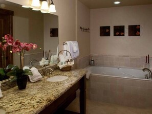 Combined shower/bathtub, hair dryer, towels, soap