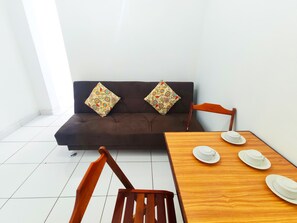 Apartamento conforto | Área de estar | TV LED