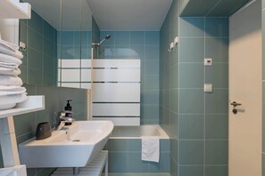 Bathtub, hair dryer, towels