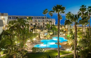 Calming pool and tropical landscaping at North Coast Village. - Spacious 2BR Beach Condo | North Coast Village (Oceanside)