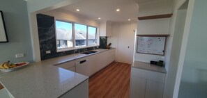 Fridge, microwave, oven, stovetop - Family beach house at the Mount (Bay of Plenty)
