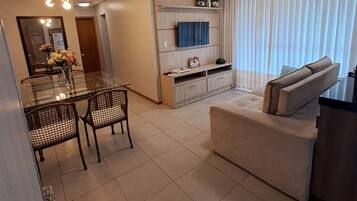 Premium Apartment | Living area | 55-inch Smart TV with cable channels, TV, Netflix