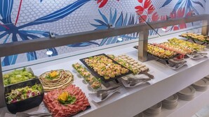 A buffet with various food items including salads, meats, and appetizers. - Hotel Tahiti Playa and Suites (Santa Susanna)