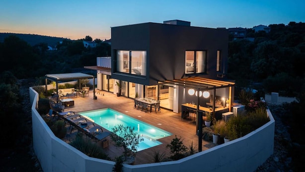 A modern house with a swimming pool, outdoor seating, and a large glass window. - Luxury Villa Silvery with Pool (Kanica)