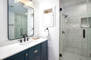 Combined shower/bathtub, hair dryer, towels, toilet paper