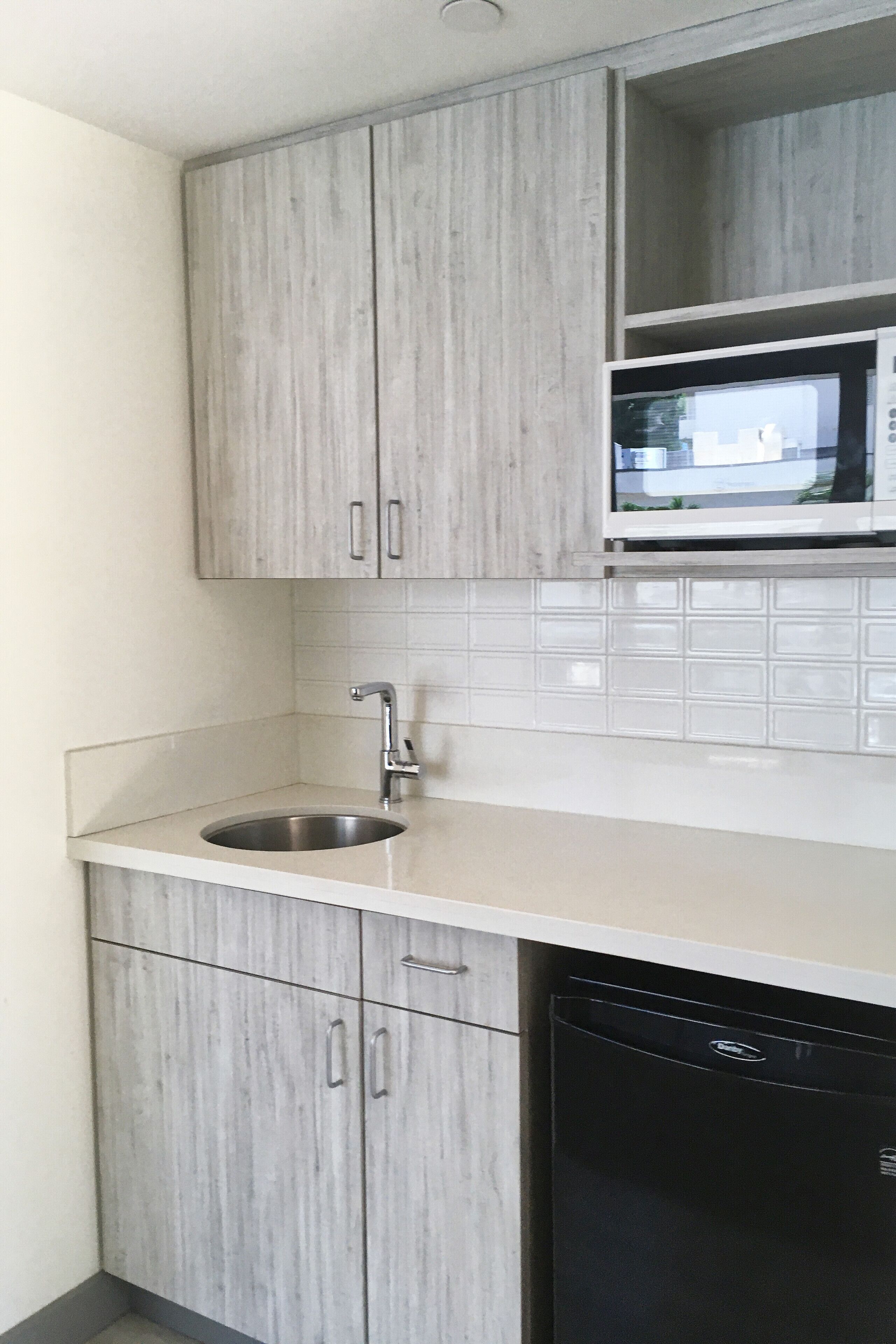 mini-fridge, coffee/tea maker, electric kettle, dining tables