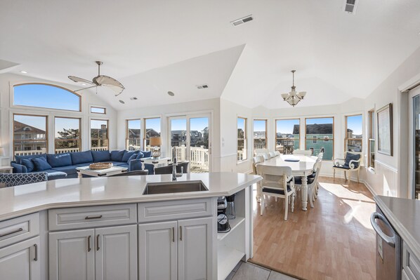 Enjoy meals in the kitchen with a large island and dining area offering expansive views.