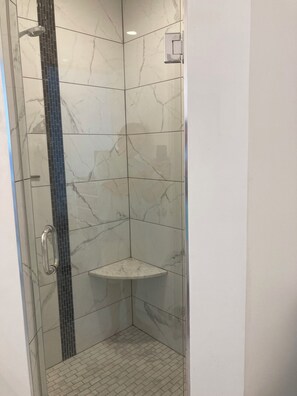 Bathtub, hair dryer, towels, soap
