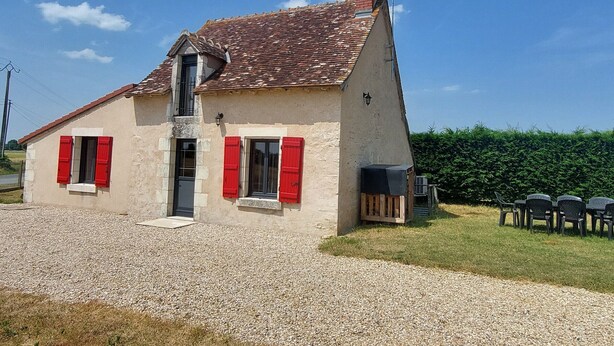 A two-story house with red shutters, a chimney, and a gravel driveway. - Charming Berry Home near Zoo de Beauval & Medieval Loches, Private Parking, Shared Garden (Arpheuilles)
