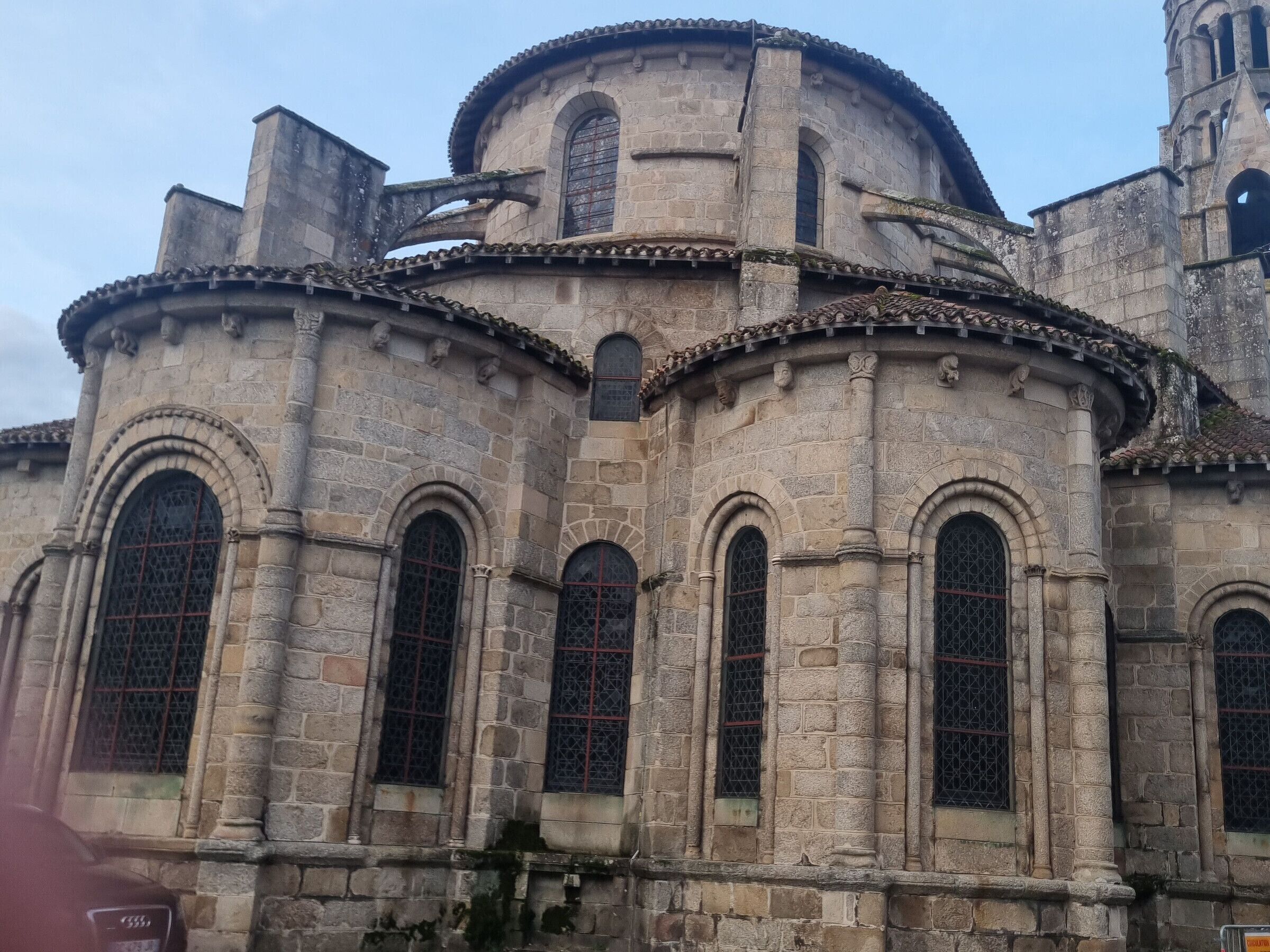 A historic stone building with arched windows and a dome.