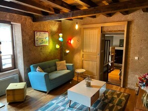 TV, fireplace - Cozy Renovated Forge with Sauna, Shared Pool & Nearby Attractions (Le Menoux)