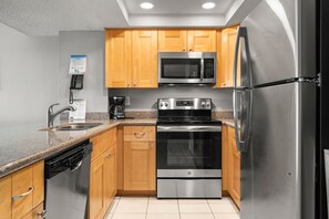 Fridge, microwave, oven, stovetop - Sandy Shores 405 1 BR Gulf Front Corner Condo (Madeira Beach)