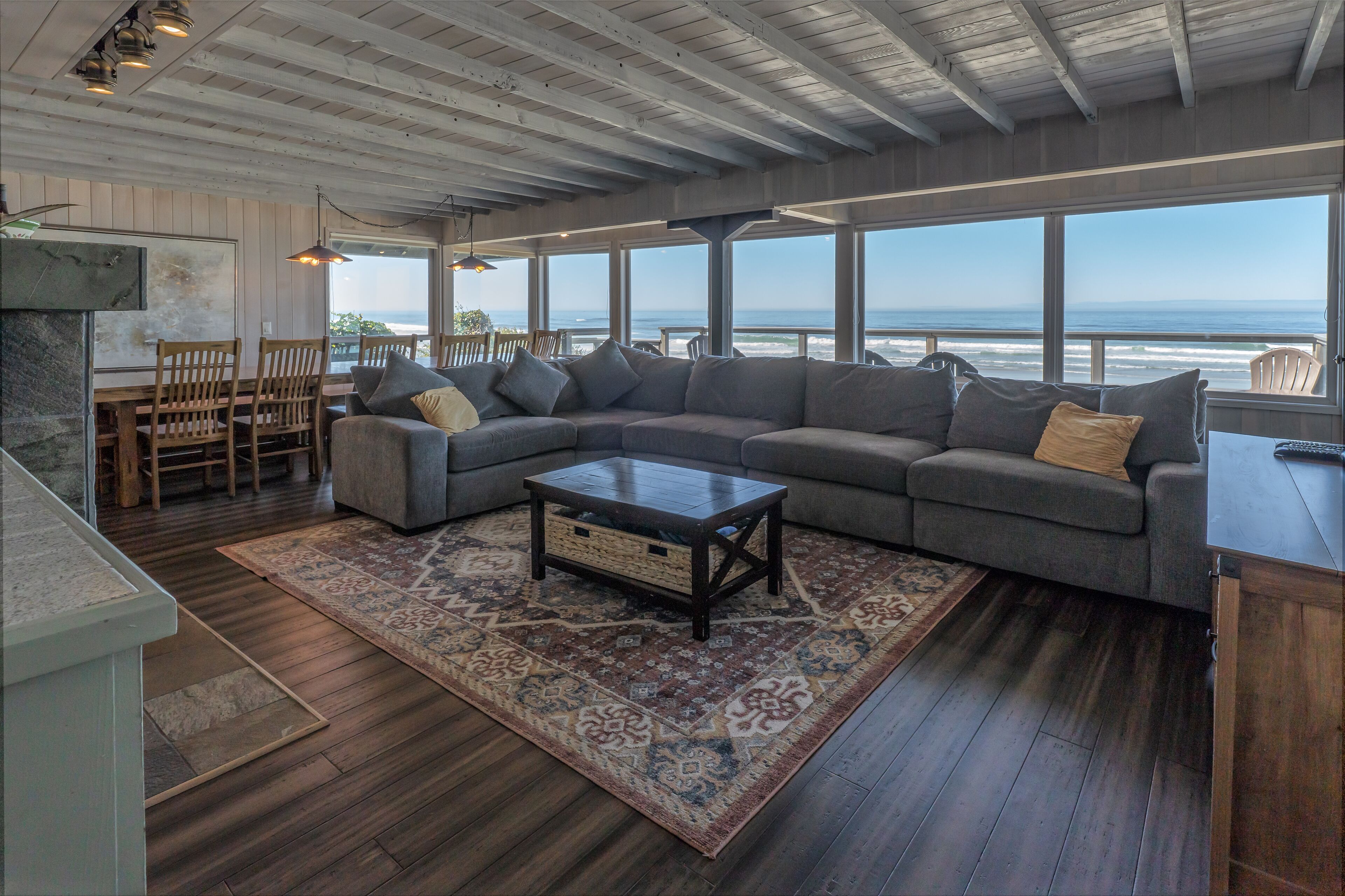 Enjoy the waves in the hot tub at this beachfront home with direct beach access