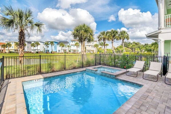 Sun-soaked Elegance: Bask in the glory of our outdoor swimming pool, where every moment is a picture-perfect escape, complemented by cozy lounge chairs for your utmost comfort.
