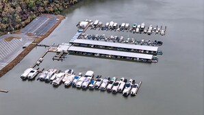 An aerial view of a marina with multiple docks and boats.