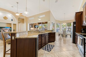 Fridge, microwave, oven, stovetop - Gulf Access, Heated Pool & Spa - BAREFOOT & FANCY FREE - Villa Barefoot - Roelens Vacations (Cape Coral)
