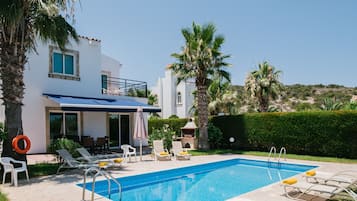 Seasonal outdoor pool, pool umbrellas, pool loungers