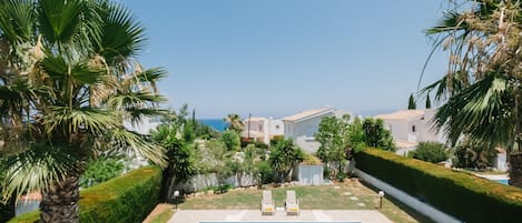 Seasonal outdoor pool, pool umbrellas, pool loungers