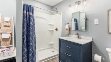 Bathtub, hair dryer, towels, soap