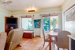 TV - Colorful oceanfront condo with shared pool, WiFi, ocean view, and central AC (Placencia)