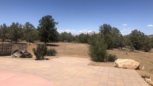 A paved outdoor area with a view of a mountainous landscape. - Southern Utah getaway  (Apple Valley)