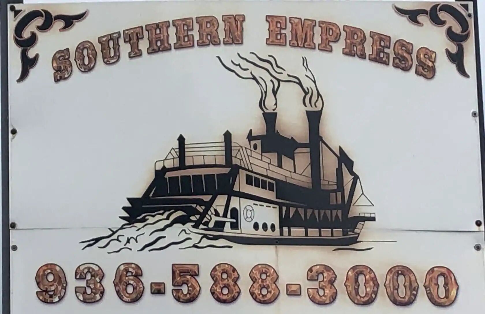 A sign with a steamboat illustration and the text "Southern Express" and a phone number.