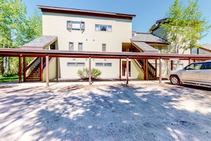 Stunning two-story residence with a spacious balcony and a pitched roof.