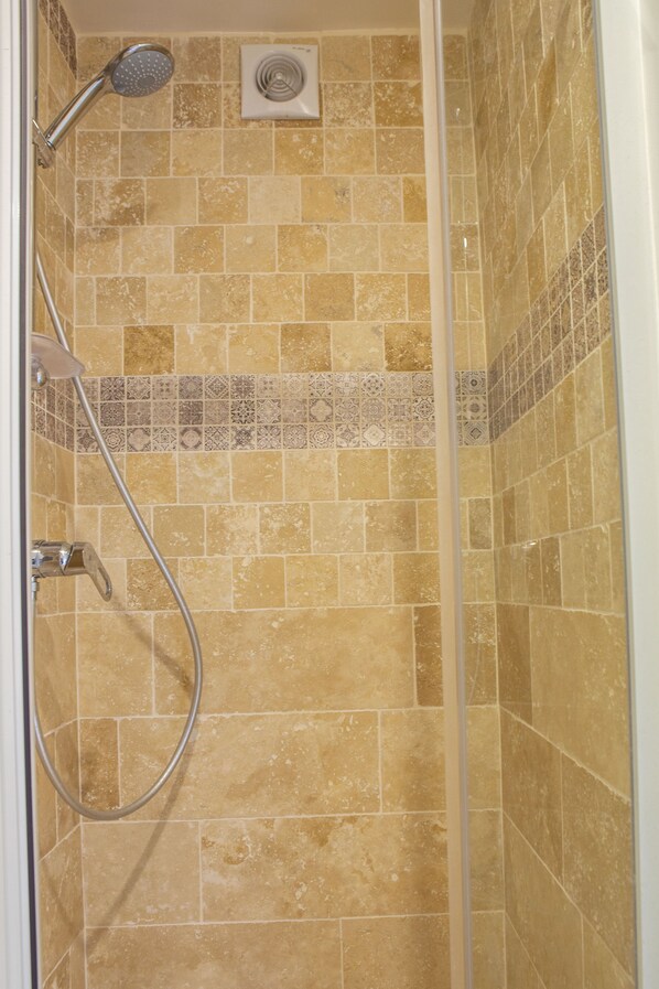 Shower, eco-friendly toiletries, hair dryer, towels