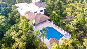 A resort with a pool, thatched-roof structures, and solar panels. - Private Villa w/Pool Heat option Near Akumal/Tulum (Akumal)