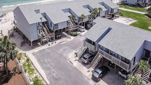 A beachfront hotel with multiple buildings, a parking area, and a view of the ocean. - End-Unit, 1BR/1BA, Ocean Mile J-13 'Picture Perfect', Near State Park (St. George Island)