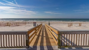 A wooden boardwalk leading to a beach with a clear sky. - End-Unit, 1BR/1BA, Ocean Mile J-13 'Picture Perfect', Near State Park (St. George Island)