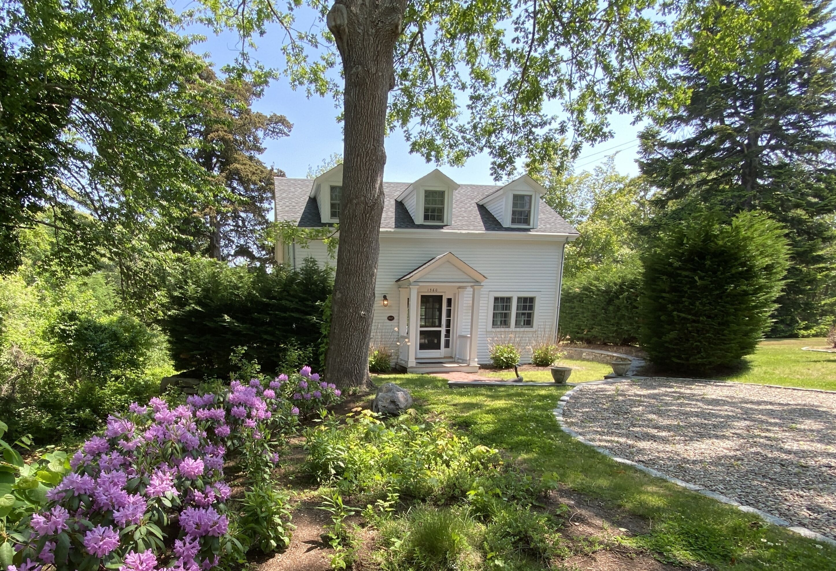 Renovated historic Carriage House with waterview in the heart of Brewster's Main Street!
