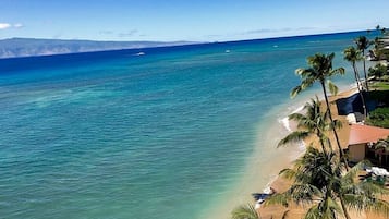 On the beach, sun loungers, beach towels